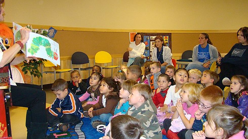 Children being read The Very Hungry Caterpillar