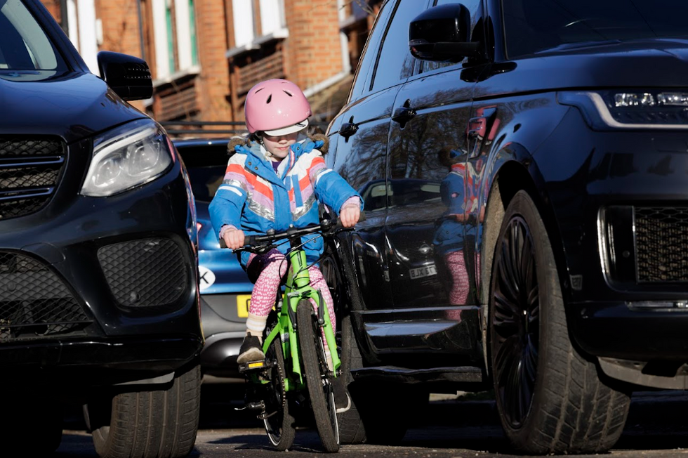 Children near SUVs