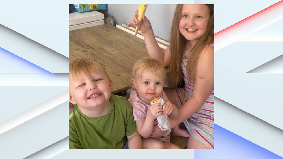 Children pictured after house fire in Bradford