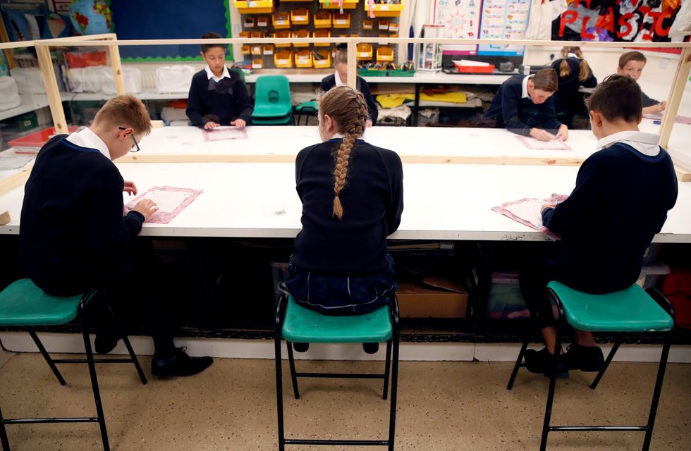 Children sit in a classroom in Watton at Stone.