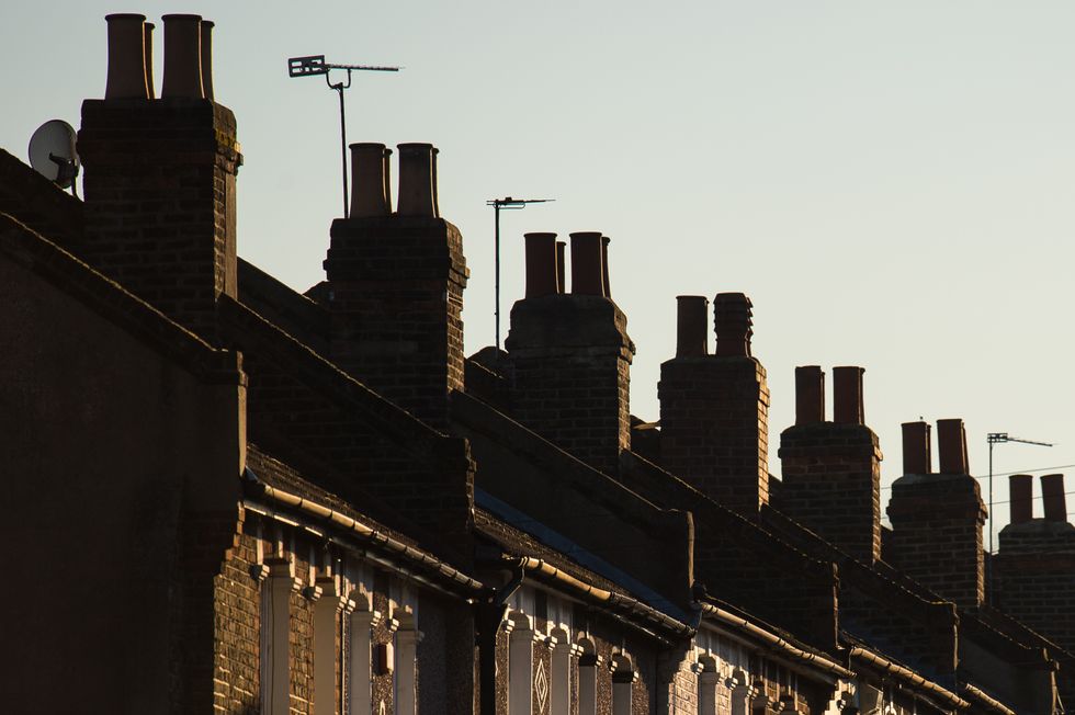 Chimneys on a row of terraced residential houses in south east London.
