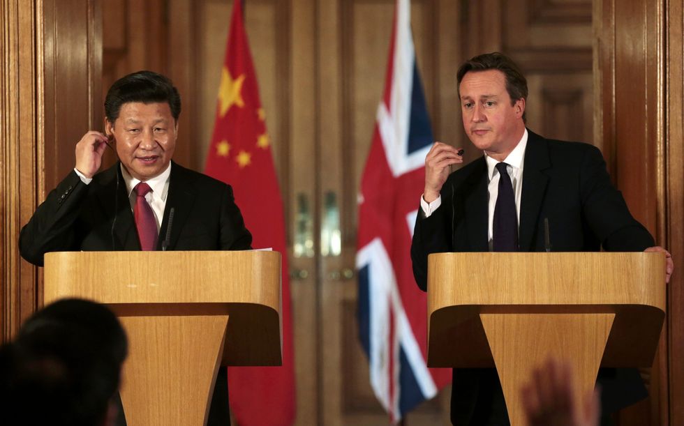 China's President Xi Jinping and Britain's Prime Minister David Cameron attend a joint press conference in 10 Downing Street on October 21, 2015