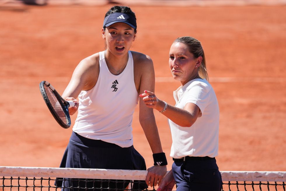 China's Wang Xinyu crossed the net after being furious with the umpire's decision