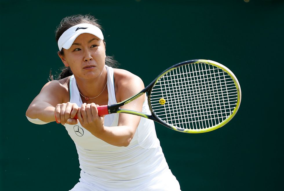 China's Shuai Peng in action against Czech Republic's Petra Kvitova during day eight of the Wimbledon Championships at the All England Lawn Tennis and Croquet Club, Wimbledon.