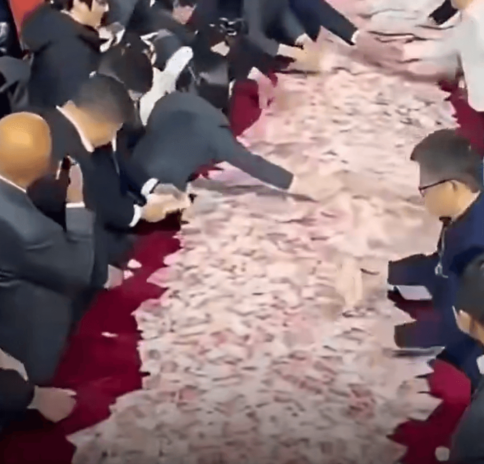 Chinese company lays out money for employees