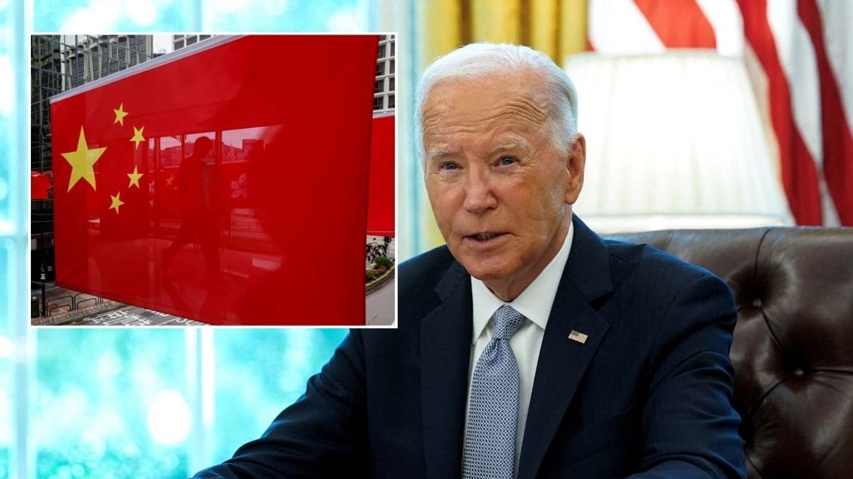 Chinese flag and President Joe Biden sitting in the White House