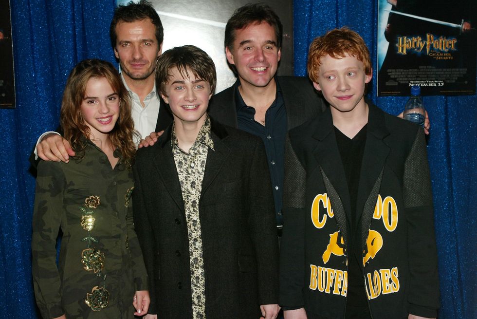 Chris Columbus (second from left) with Harry Potter stars Emma Watson (left), Daniel Radcliffe (middle), and Rupert Grint (right)