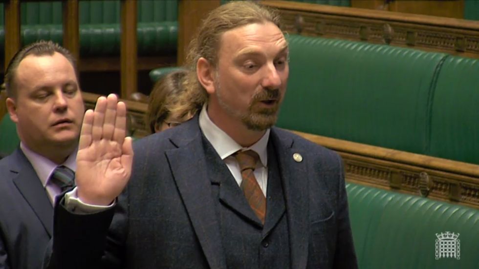 Chris Law of the SNP being sworn in as the MP for Dundee West in the House of Commons