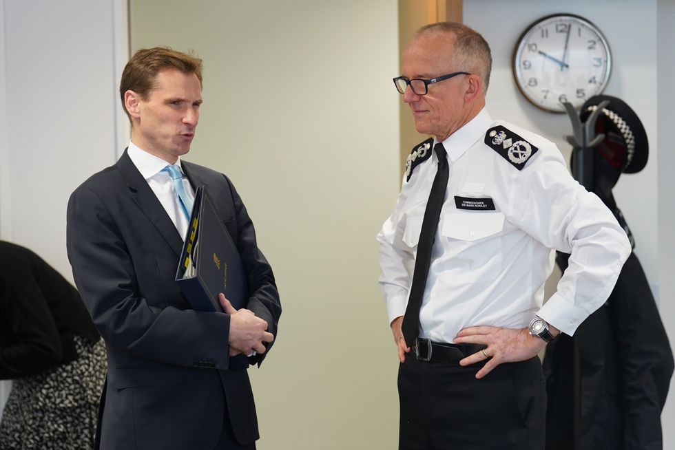 Chris Philp MP talks to Metropolitan Police Commissioner Sir Mark Rowley (right) at a meeting of the National Policing Board at the Home Office in London.