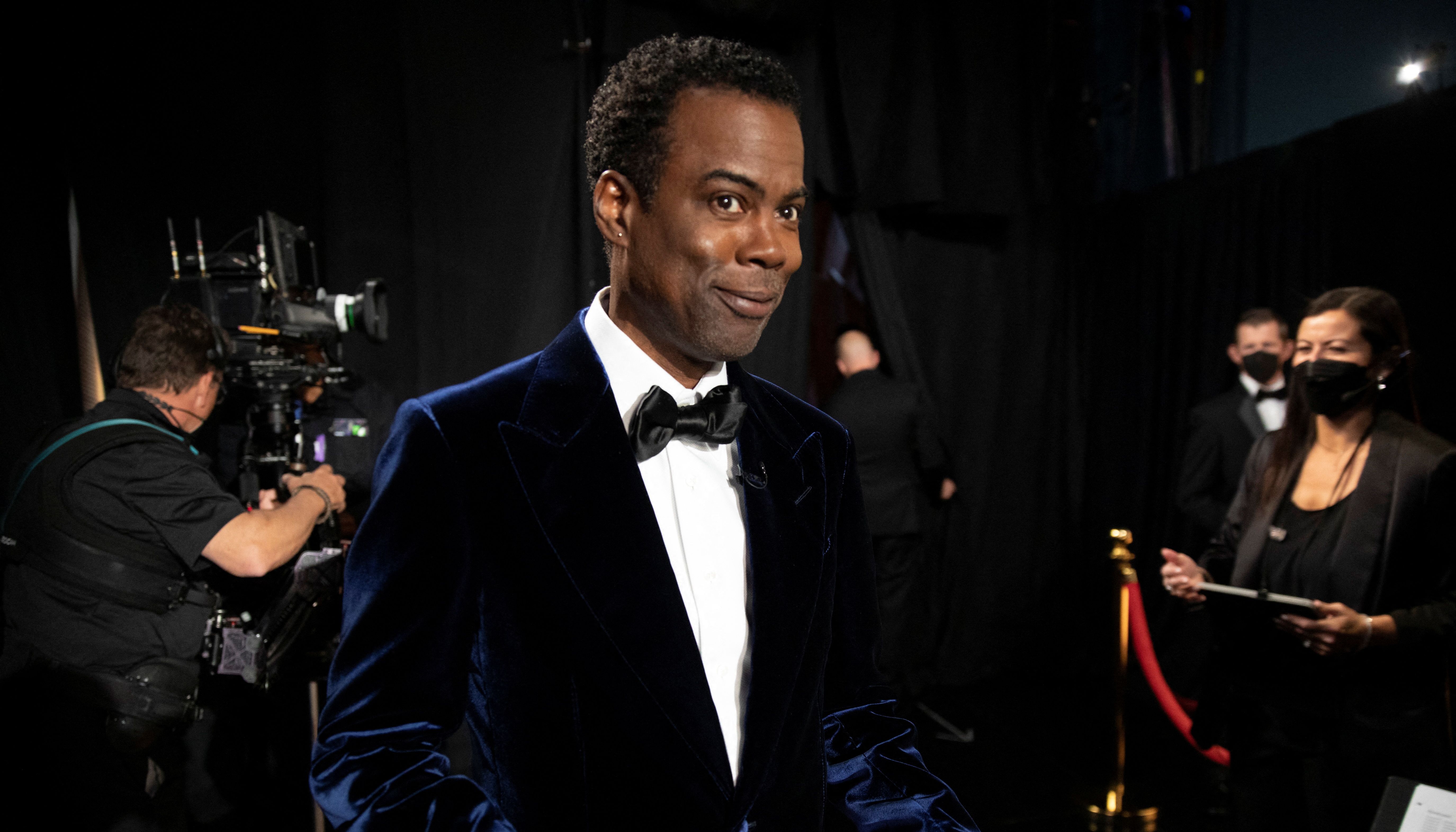 Chris Rock stands backstage at the 94th Academy Awards in Hollywood, Los Angeles, California, U.S., March 27, 2022. Al Seib/A.M.P.A.S./Handout via REUTERS ATTENTION EDITORS. THIS IMAGE HAS BEEN SUPPLIED BY A THIRD PARTY. NO MARKETING OR ADVERTISING IS PERMITTED WITHOUT THE PRIOR CONSENT OF A.M.P.A.S AND MUST BE DISTRIBUTED AS SUCH. MANDATORY CREDIT.