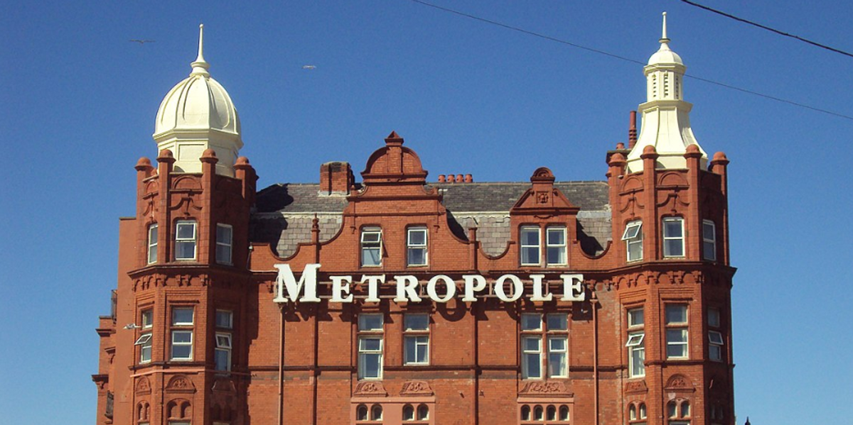 NextImg:'We need our hotel back' - MP fights to remove hundreds of migrants from iconic tourist hotel