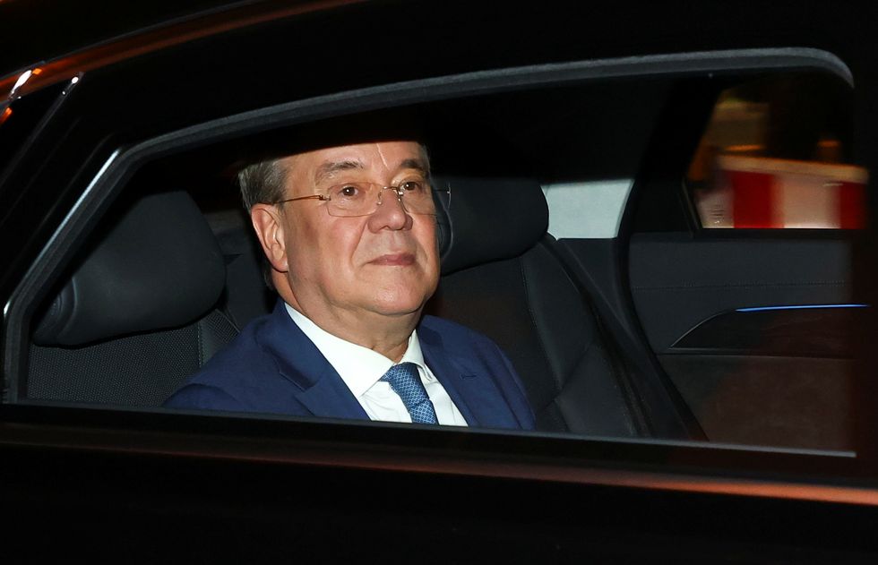 Christian Democratic Union (CDU) leader and top candidate for chancellor Armin Laschet returns to the party headquarters after first exit polls for the general elections in Berlin, Germany, September 26, 2021. REUTERS/Fabrizio Bensch