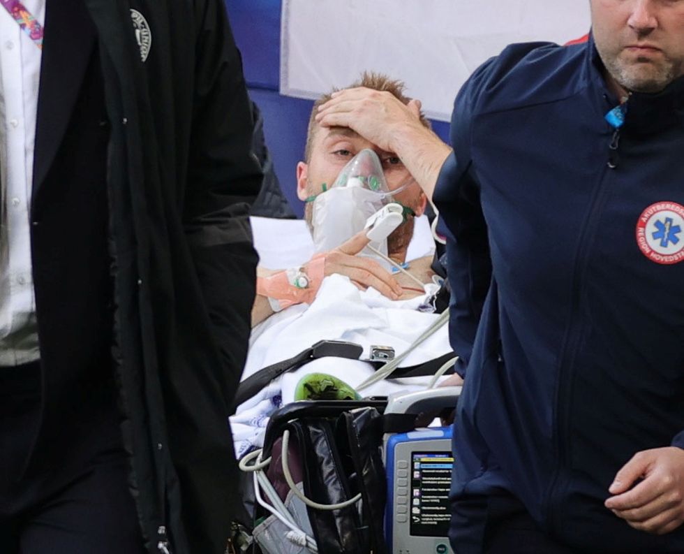 Christian Eriksen was carried off after collapsing during the match