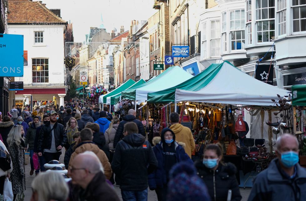 Christmas shoppers make their way along the High Street in Winchester, as the government refused to rule out introducing further restrictions to slow the spread of the Omicron variant of coronavirus Picture date: Tuesday December 21, 2021.