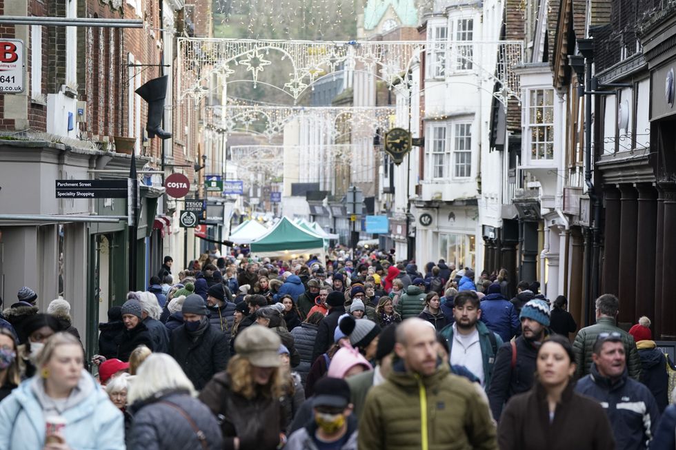Christmas shoppers make their way along the High street in Winchester, Hampshire, 2021