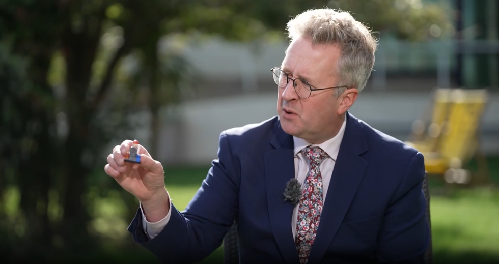 Christopher Hope holding up one of the Liberal Democrats' plastic patriot figures