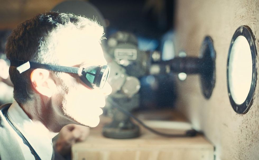 Cillian Murphy in Oppenheimer as the physicist watches a bomb test