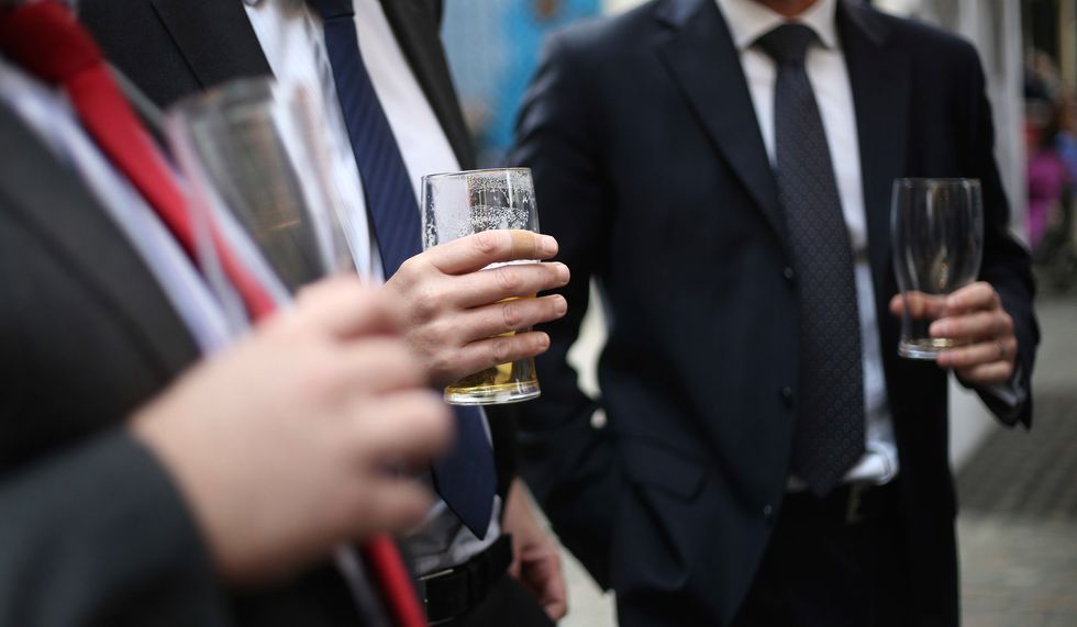 City Workers drinking in Leadenhall Market in the City of London.