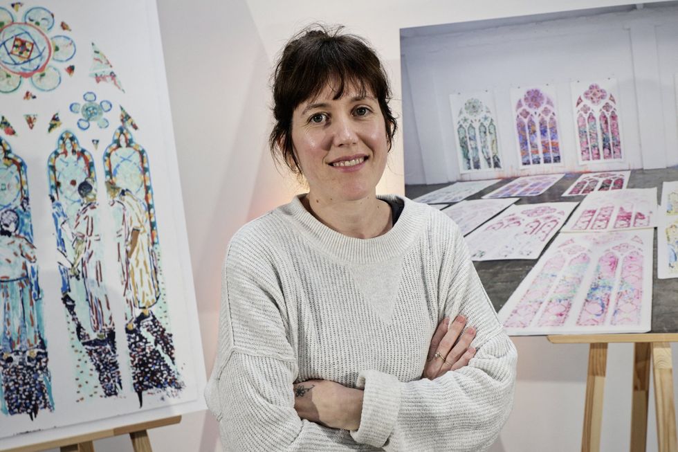 Claire Tabouret in front of her Notre Dame window designs
