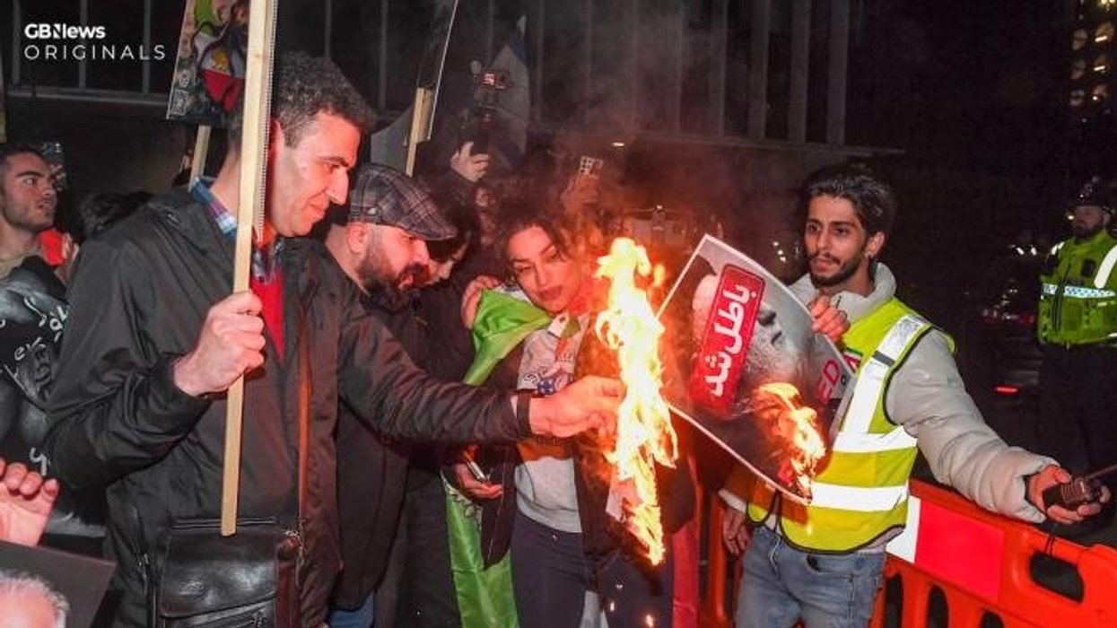 Armed police swarm Manchester park after man seen wearing 'suicide vest'... but the reality is not what it seems