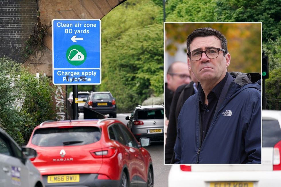 Clean Air Zone signs and Manchester Mayor Andy Burnham