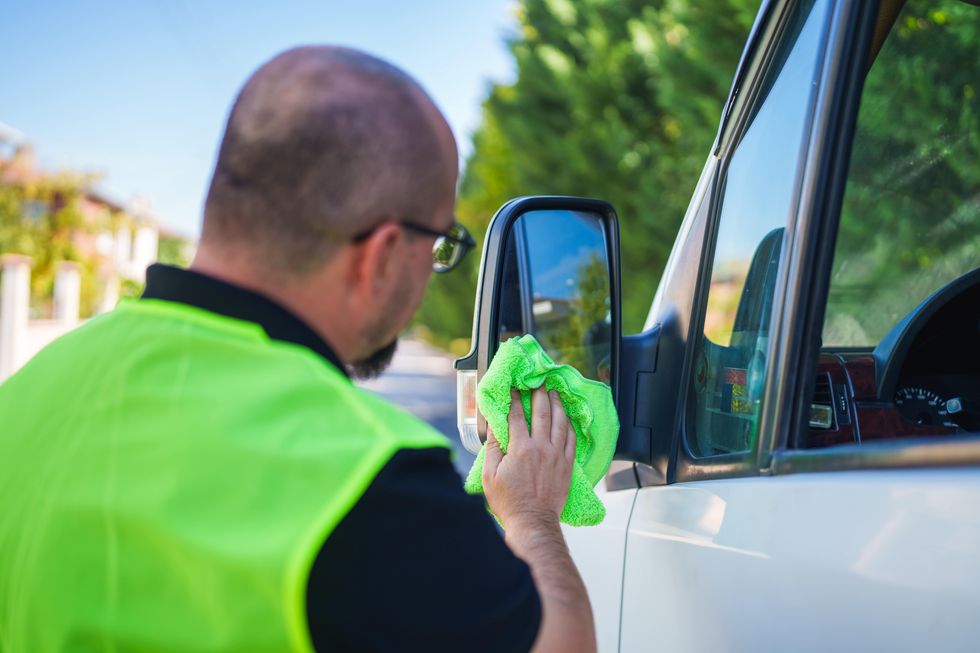 Cleaning car with microfibre cloth