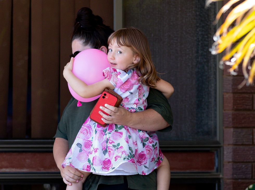 Cleo Smith and her mother Ellie Smith leave a house where the girl spent her first night after being rescued in Carnarvon, Australia, November 4, 2021.