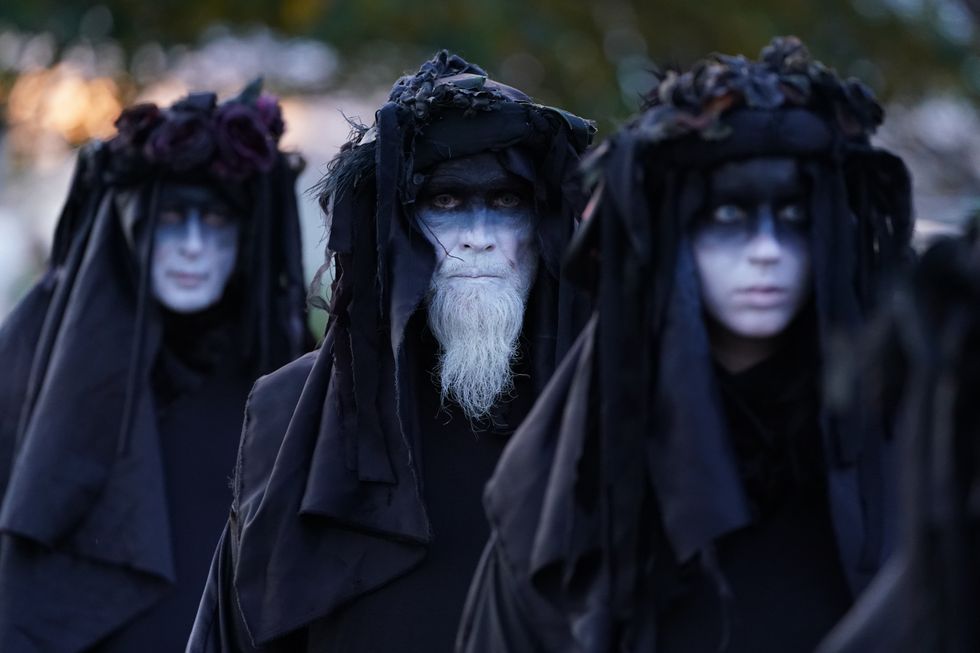 Climate activists from Ocean Rebellion, representing 'oil slicks' protest outside Grangemouth Oil Refinery in Falkirk, during Cop26 in Glasgow.