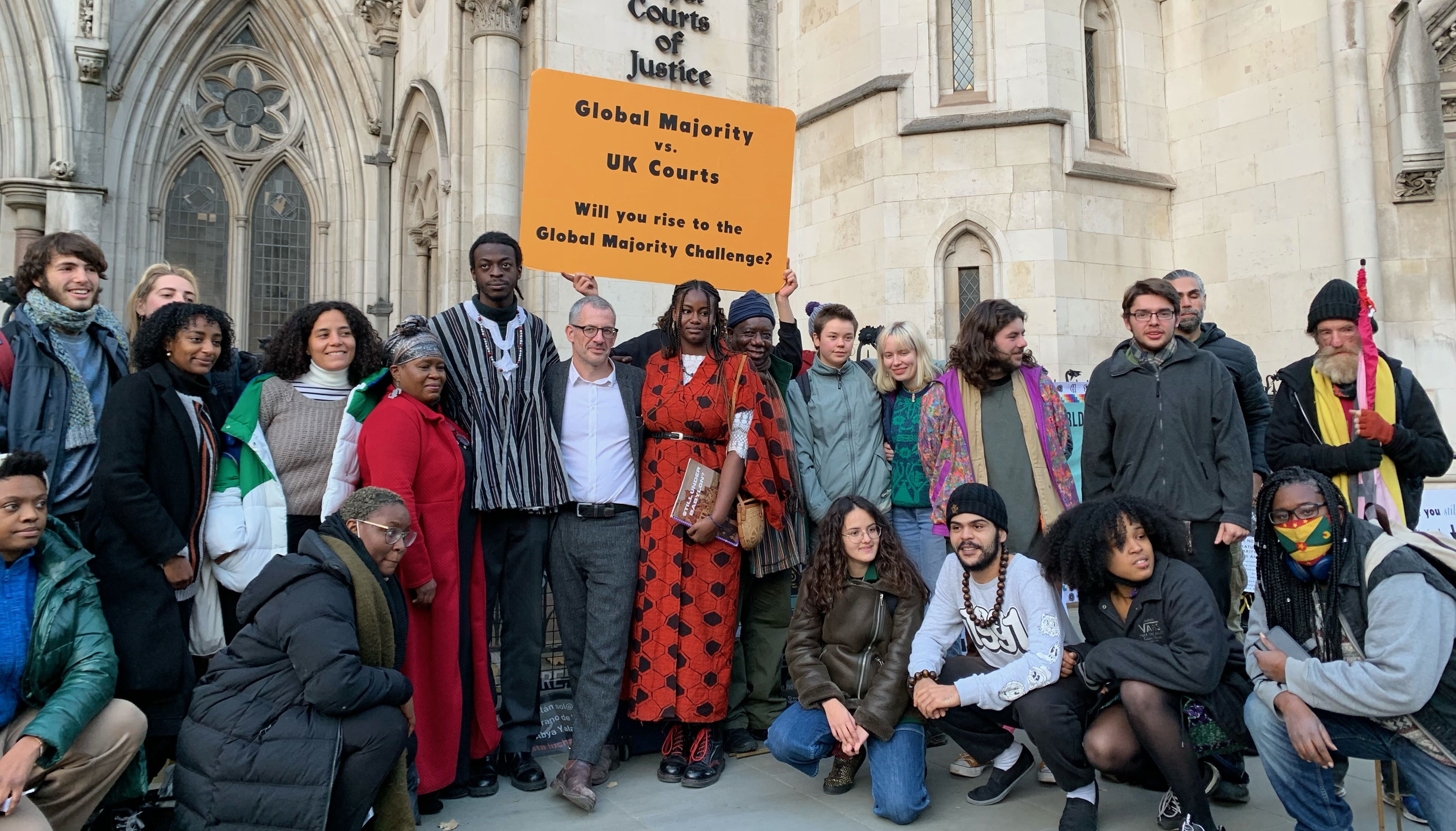 Climate activists outside the Royal Courts of Justice in London. Environmental campaigning organisation Plan B Earth, its director Tim Crosland and three young activists - Adetola Stephanie Onamade, Marina Tricks and Jerry Amokwandoh