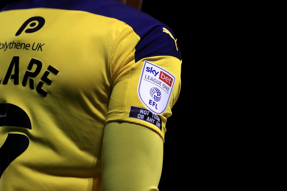 Close up of Oxford United's Sean Clare with the Sky Bet EFL branding and 'Not Today Or Any Day' emblem during the Sky Bet League One match at the Kassam Stadium, Oxford.