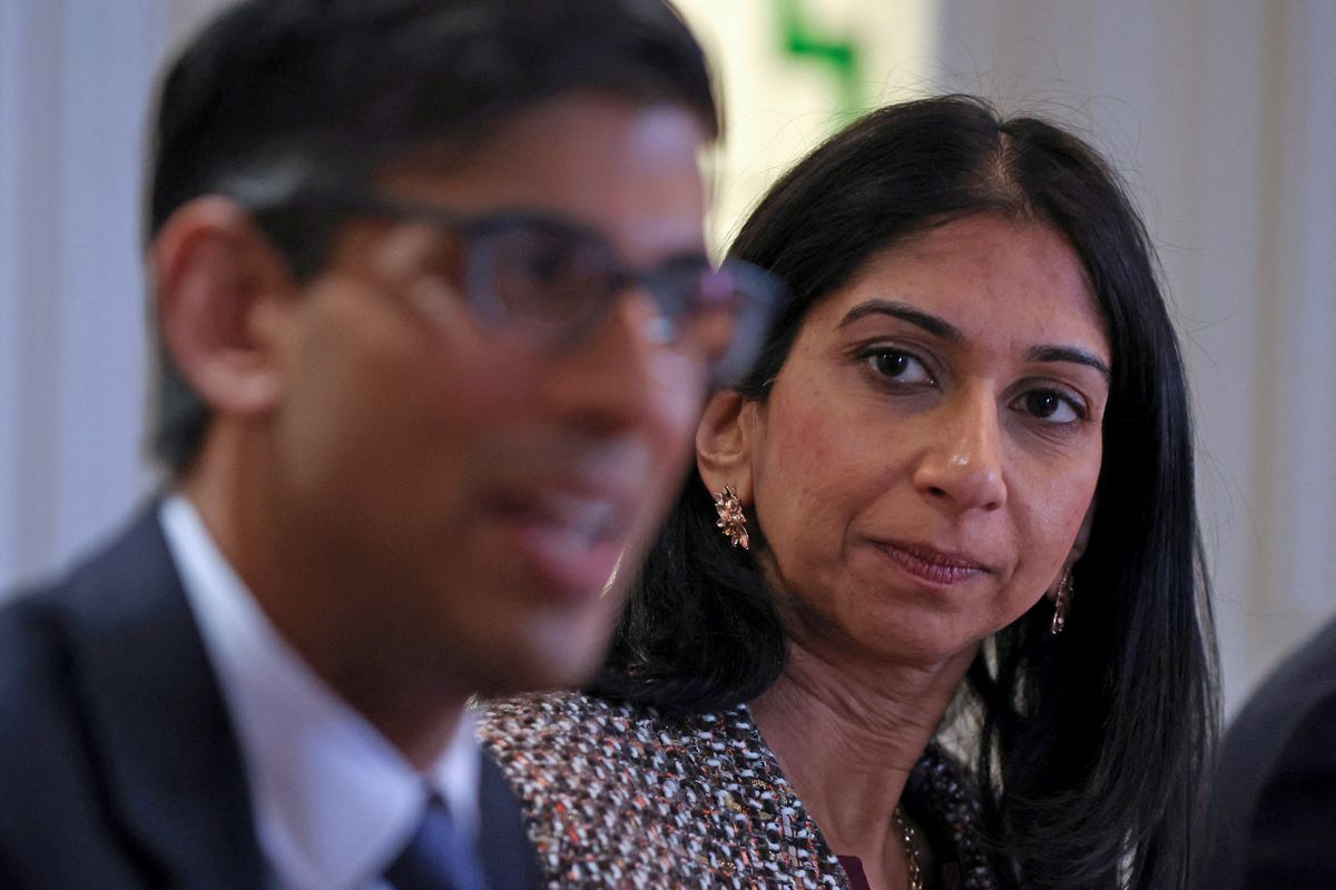 Close up of Suella Braverman looking at Rishi Sunak in the foreground
