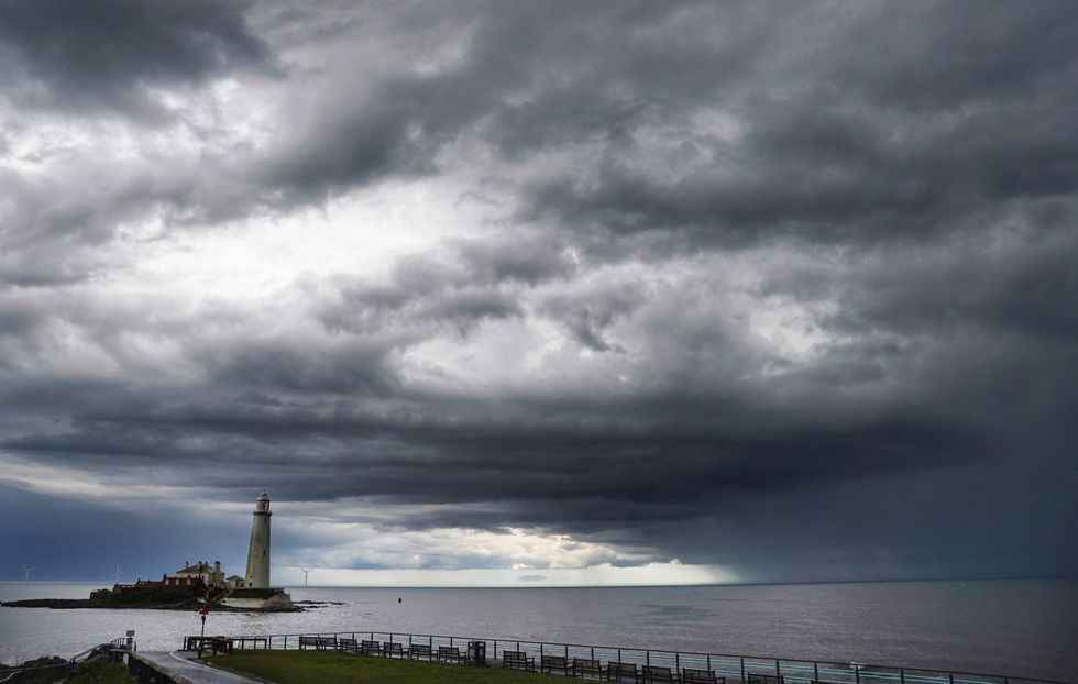 Clouds pass over St Mary's Lighthouse in Whitley Bay in the north east of England.