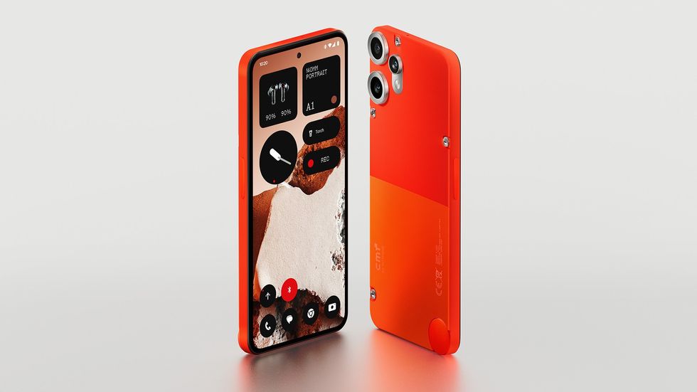 CMF Phone 2 Pro pictured in orange with the screen showing the new version of NothingOS