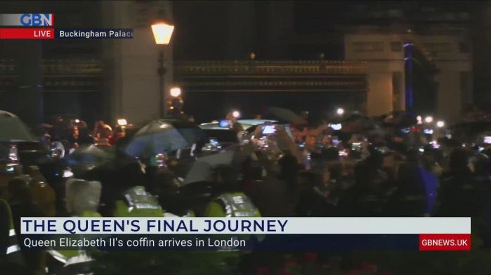Queen Elizabeth II's coffin arrives at Buckingham Palace as crowds break out into round of applause