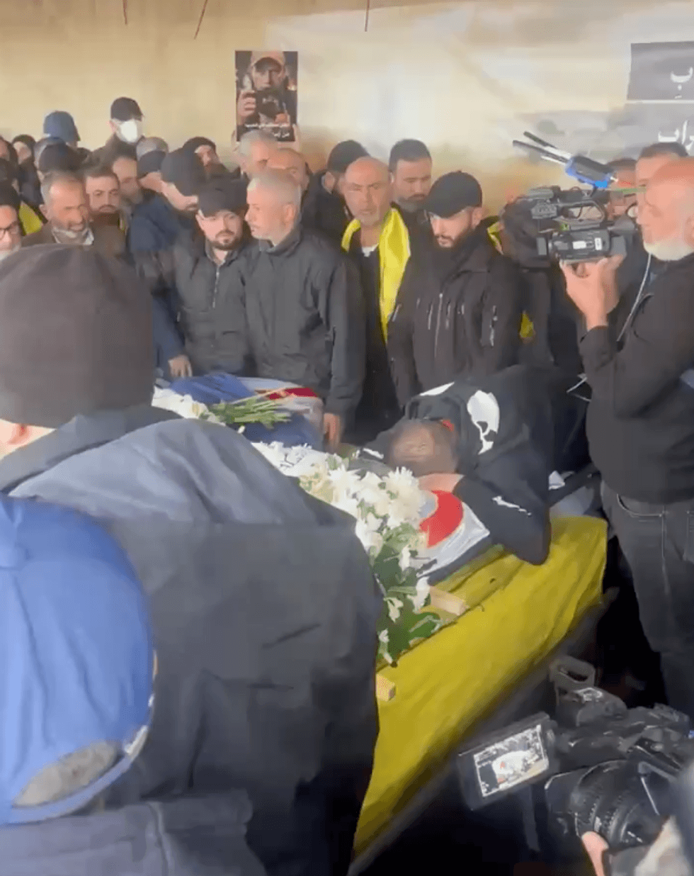 Coffin in Hezbollah flag