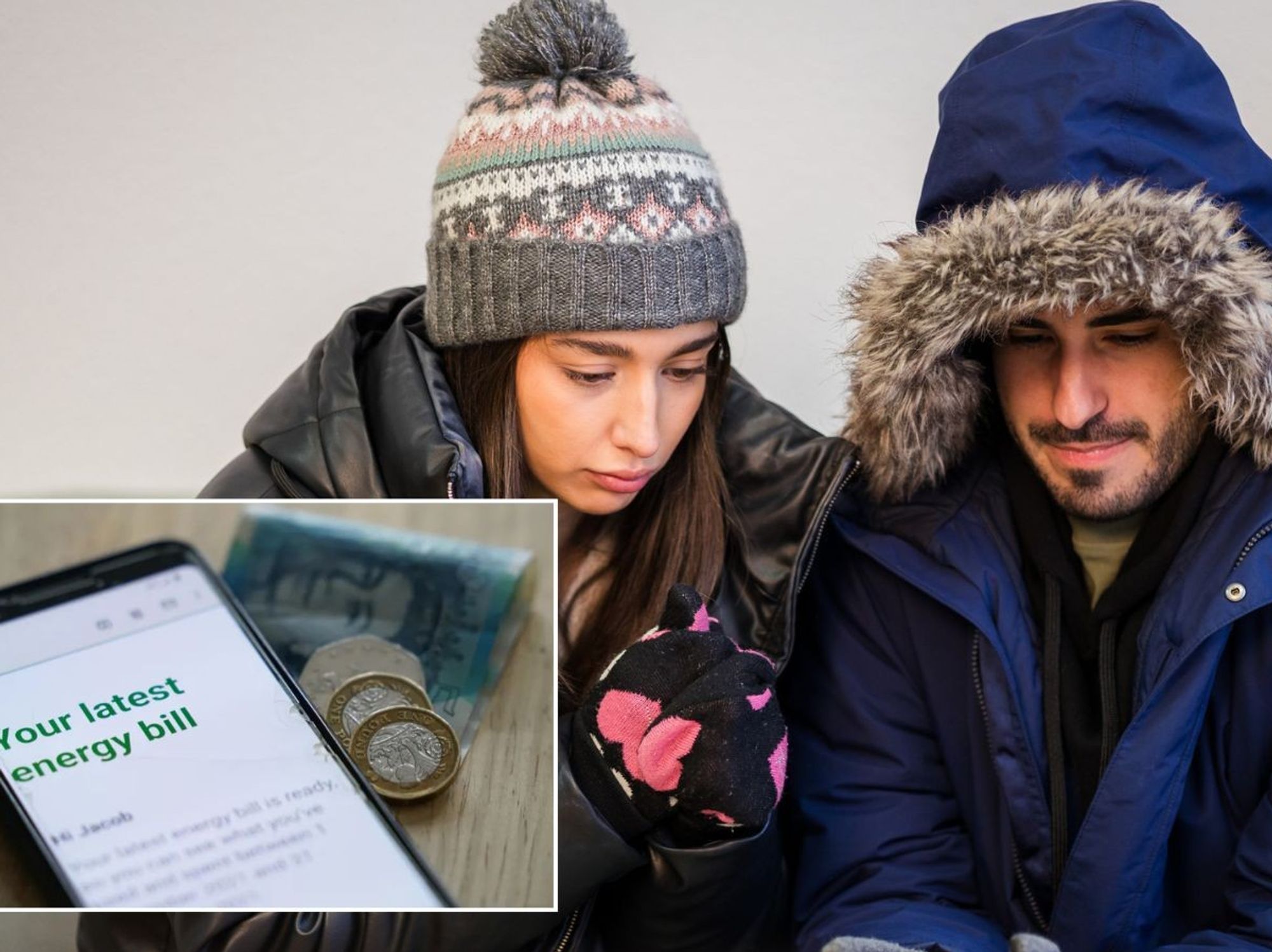 Cold couple look at energy bill