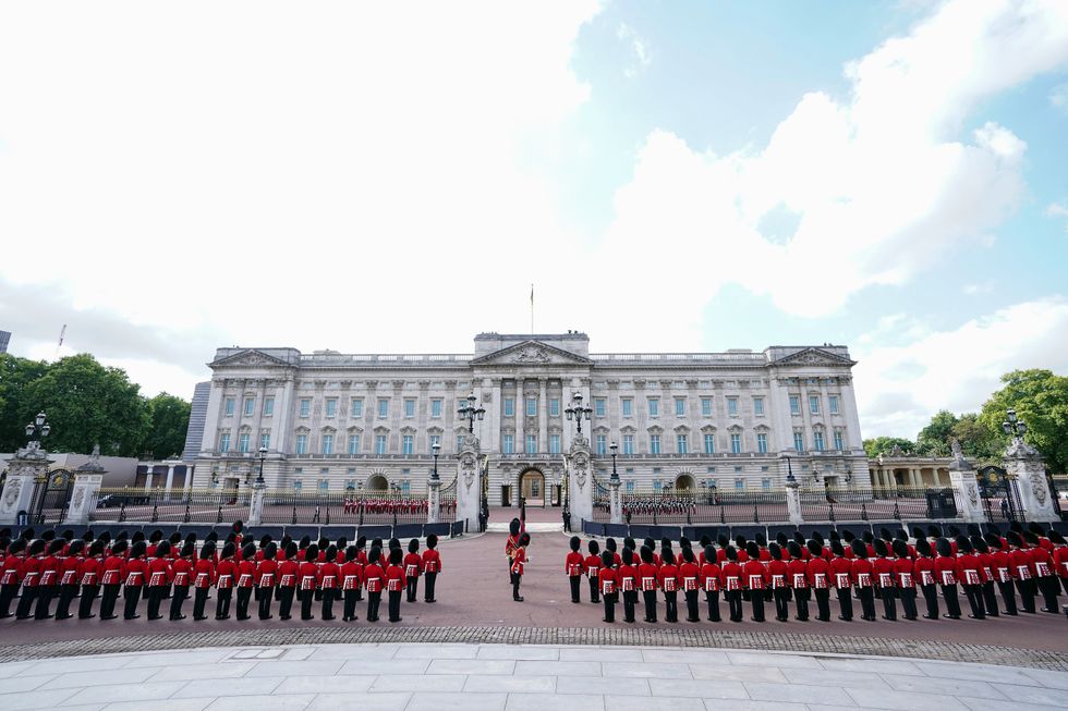 Coldstream Guards outside Buckingham Palace, ahead of the ceremonial procession of the coffin of Queen Elizabeth II from Buckingham Palace to Westminster Hall, London. Picture date: Wednesday September 14, 2022.