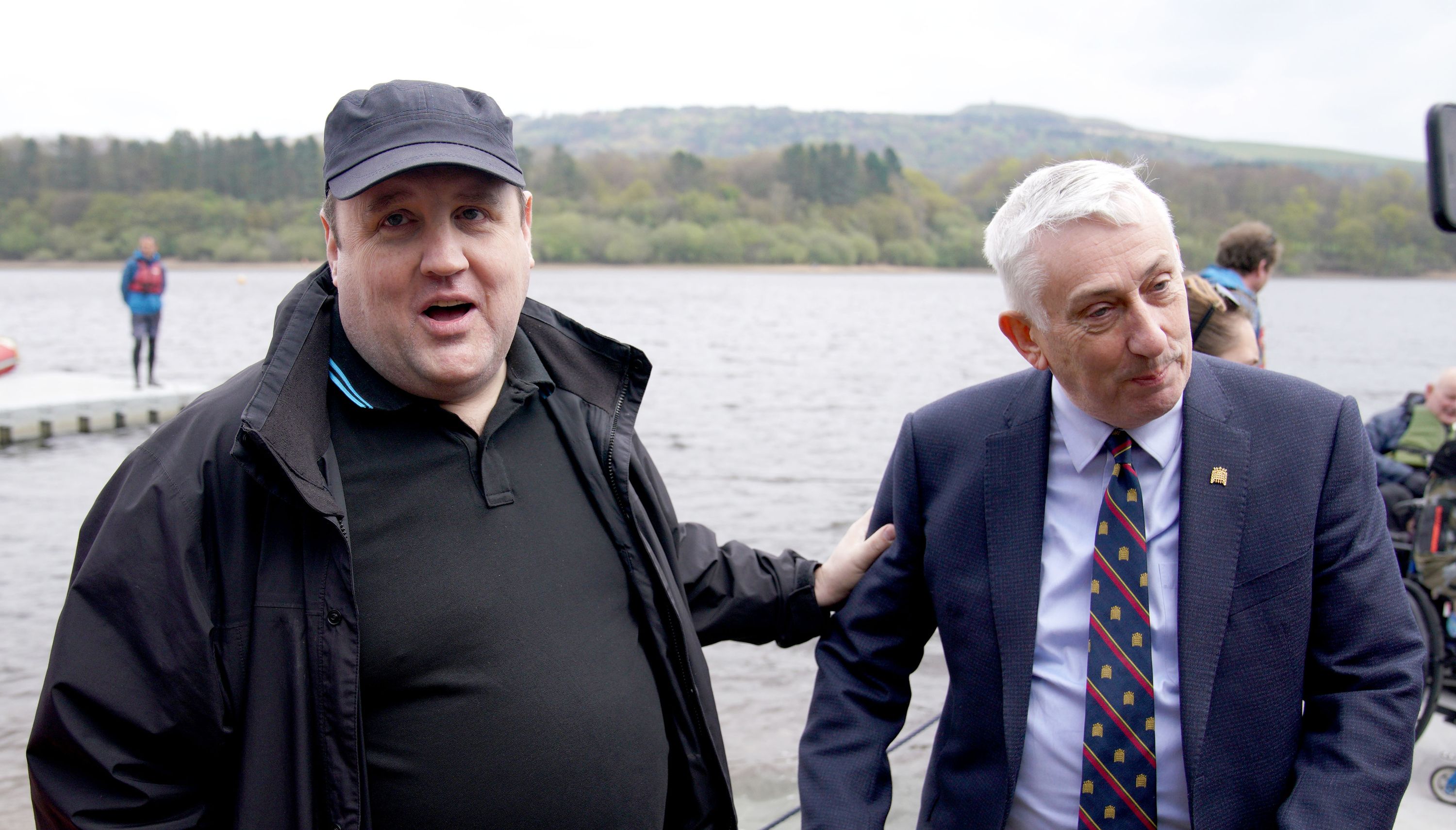 Comedian Peter Kay (left) and Speaker of the House of Commons Sir Lindsay Hoyle, during the launch of the Coulam Wheelyboat V17, a purpose-built fully wheelchair accessible powerboat at the Anderton Centre located on the banks of the Lower Rivington Reservoir near Bolton in Lancashire. Picture date: Saturday April 23, 2022.