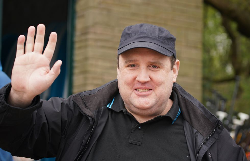 Comedian Peter Kay waves as he launches the Coulam Wheelyboat V17, a purpose-built fully wheelchair accessible powerboat at the Anderton Centre located on the banks of the Lower Rivington Reservoir near Bolton in Lancashire. Picture date: Saturday April 23, 2022.