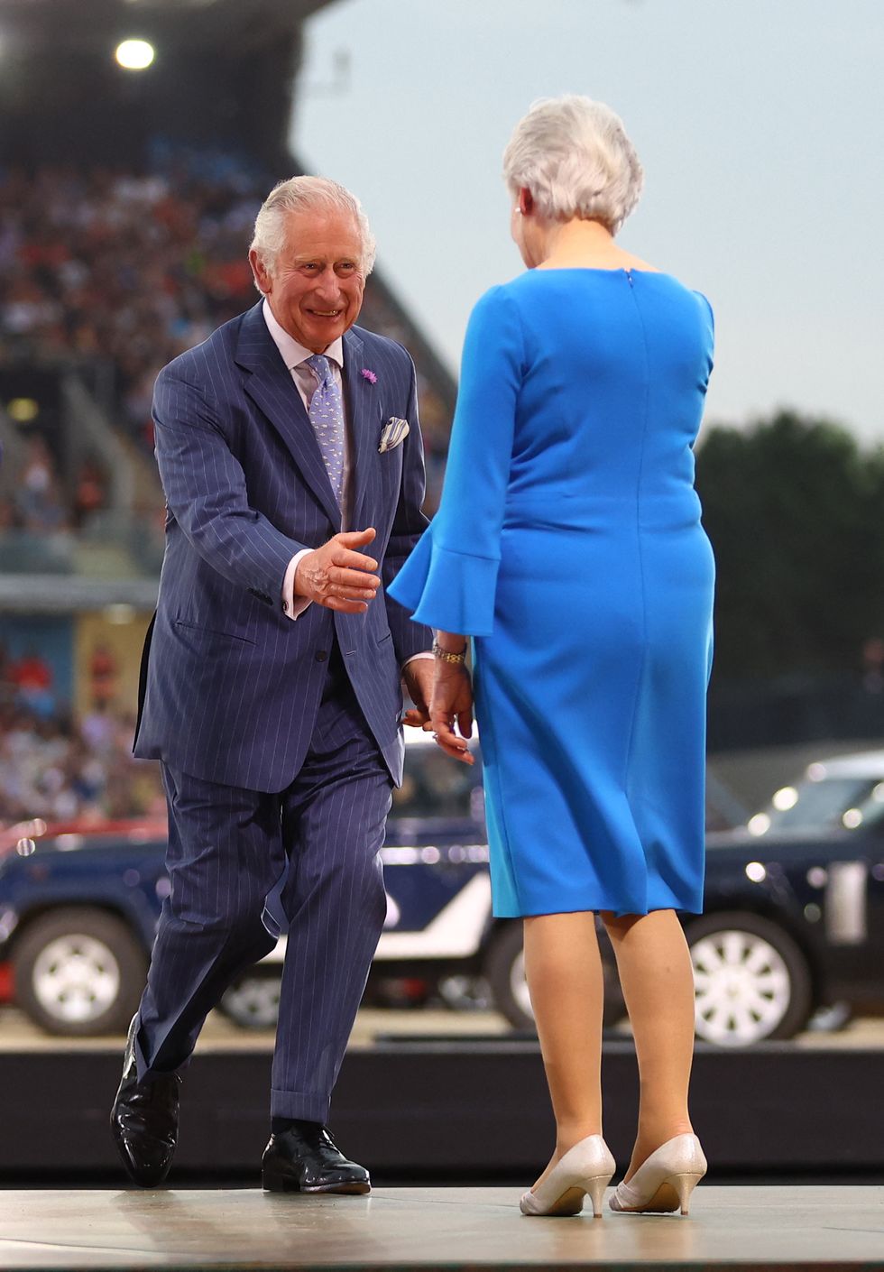 Commonwealth Games - Opening Ceremony - Alexander Stadium, Birmingham, Britain - July 28, 2022 Britain's Prince Charles shakes hands with President of the Commonwealth Games Federation Louise Martin during the opening ceremony REUTERS/Hannah Mckay
