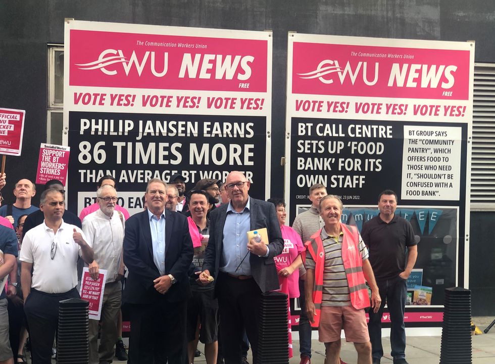 Communication Workers Union (CWU) General Secretary Dave Ward (centre) joins his members on the picket line at BT Tower, London, as thousands of BT and Openreach workers are on strike in a dispute over pay. Picture date: Friday July 29, 2022.