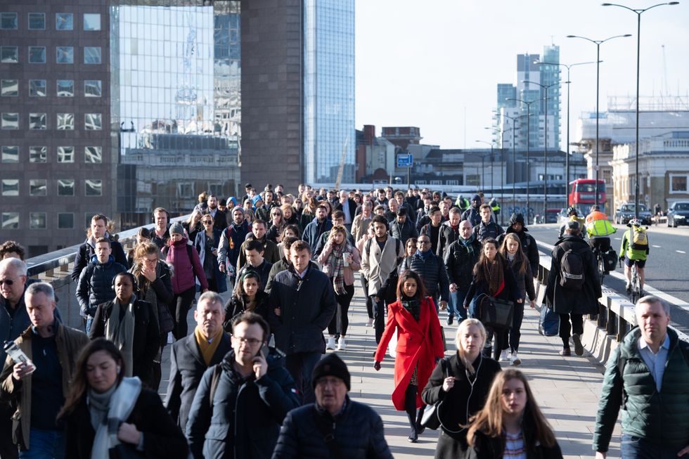 Commuters crossing London Bridge