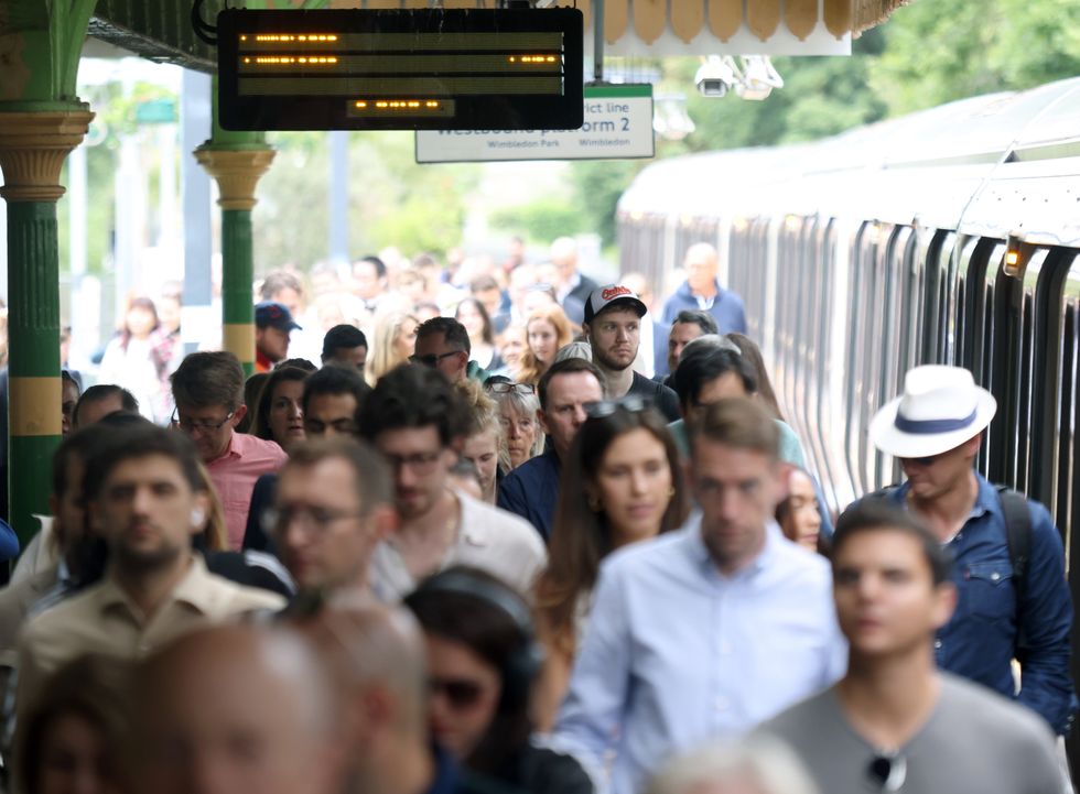 Commuters getting off train at Wimbledon