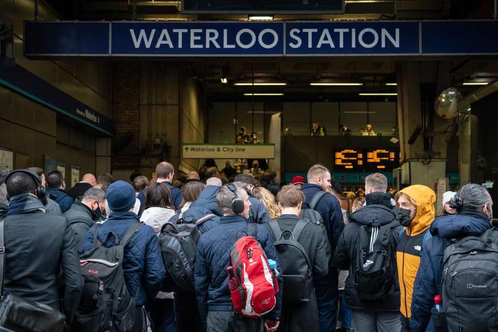 Commuters queue for the underground to resume at Waterloo station in London, as tube services remain disrupted following a strike by members of the Rail, Maritime and Transport union (RMT) on Tuesday. Picture date: Wednesday March 2, 2022.