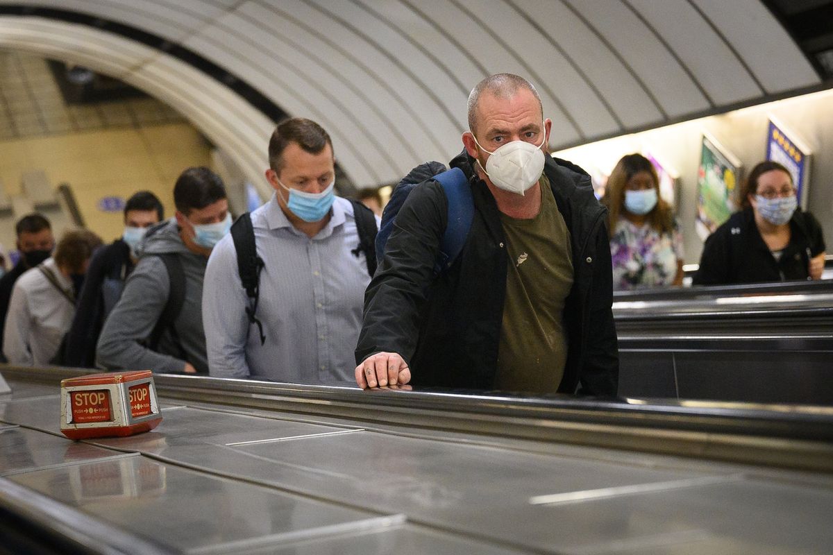 Commuters wearing face masks