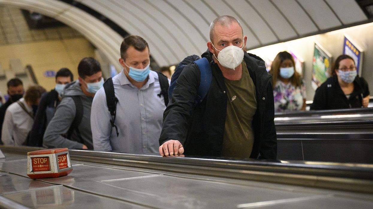 Commuters wearing face masks
