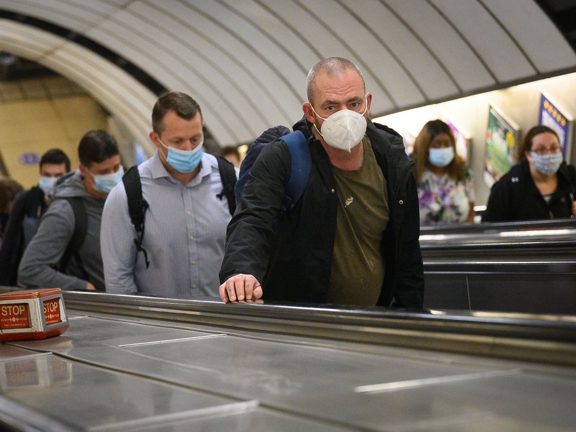 Commuters wearing face masks