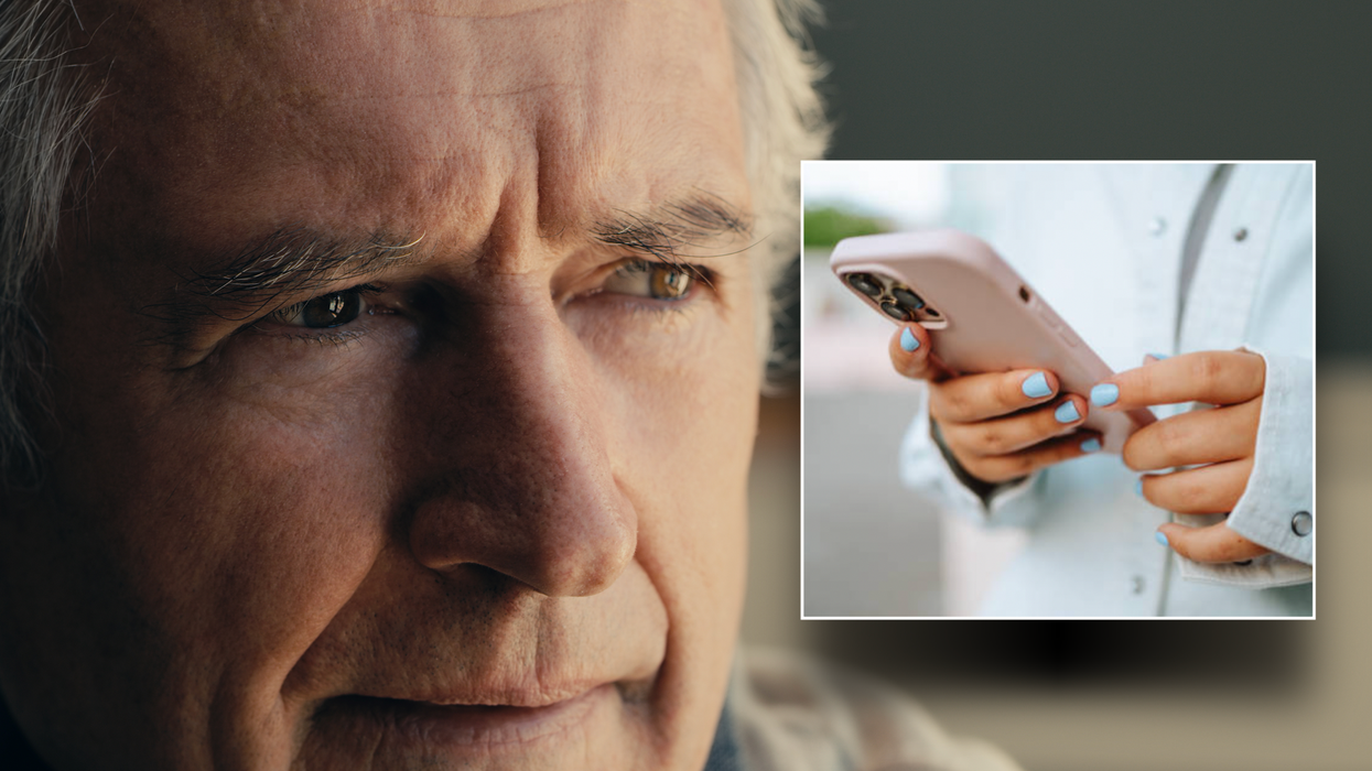 Composite image of a man looking confused and smartphone
