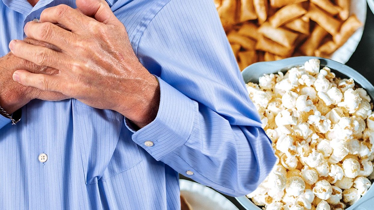 Composite image of man holding chest and processed foods