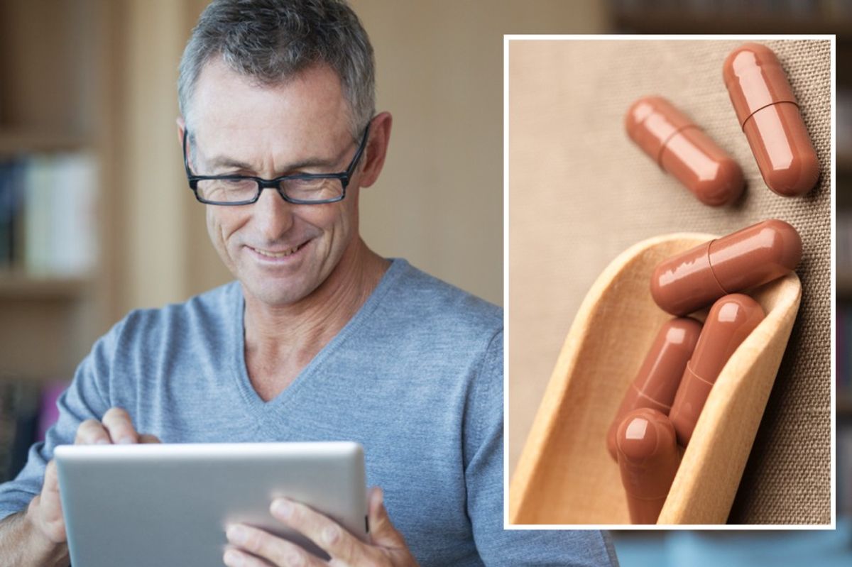 Composite image of man looking at his electronic tablet and Ginkgo biloba supplements